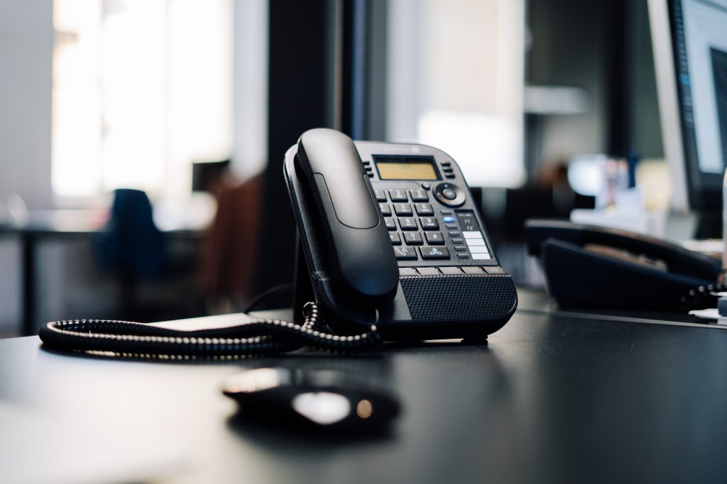 VoIP phone on a desktop - part of a VoIP phone system for business